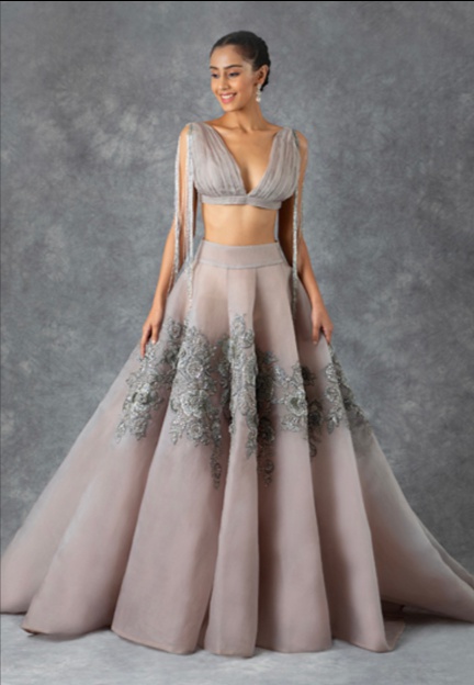 Manish Malhotra - Cascading capes, Luminous lilacs, theatrical tulles,  Tranquil teals, flattering fits, scintillating sequins and Swarovskis  Details: Lilac Swarovski and intricate embellished full sleeve corset power  shouldered #mmblouse paired with a