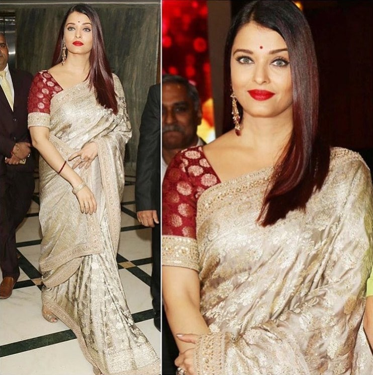 Miss World Aishwarya Rai Bachchan with glitzy saree and matched it with a red blouse