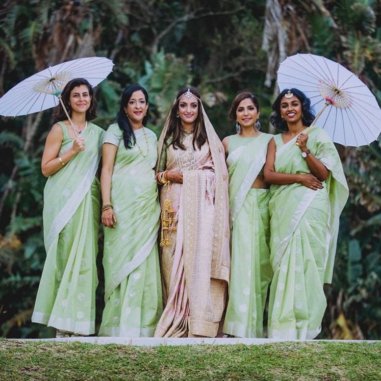 Green saree for bridesmaid and soft pink saree with a nice green lined blouse for bride Design by Sabyasachi