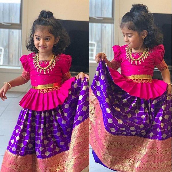 little girl is wearing a South Indian style ghagra or lehenga