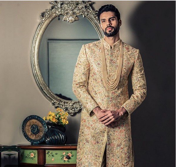 tussar color sherwani is embellished by floral embroidery