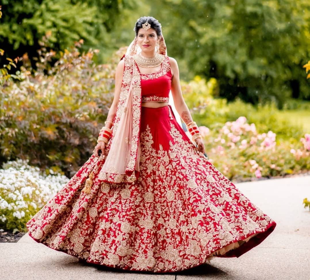 Cherry red punjabi bridal lehenga with embroidered lehenga skirt