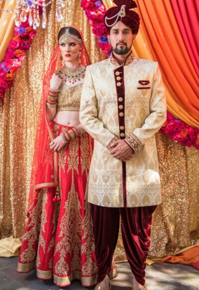 Golden and red blended Punjabi bridal lehenga