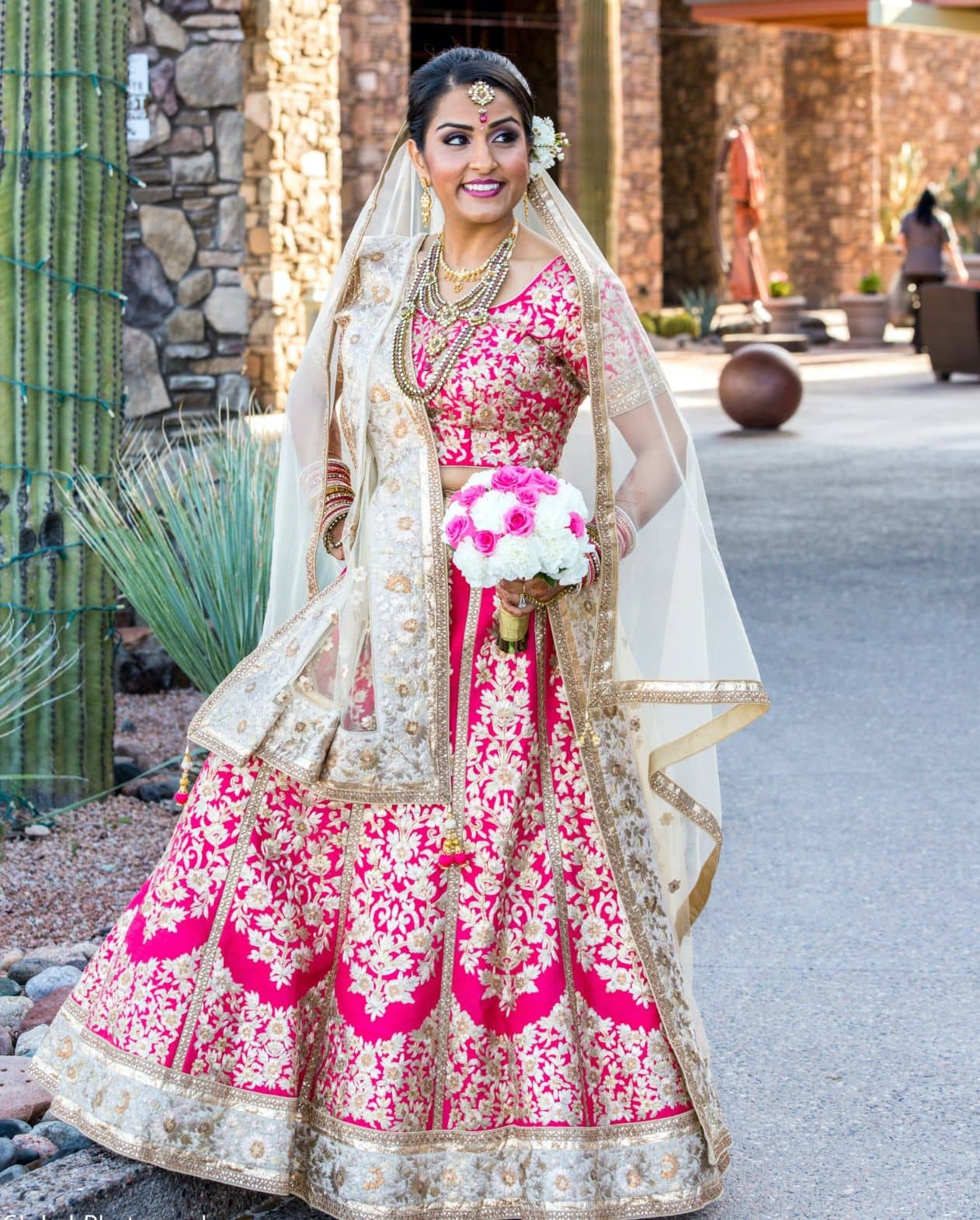 Mesmerizing Punjabi bridal lehenga in dark pink and mint green color