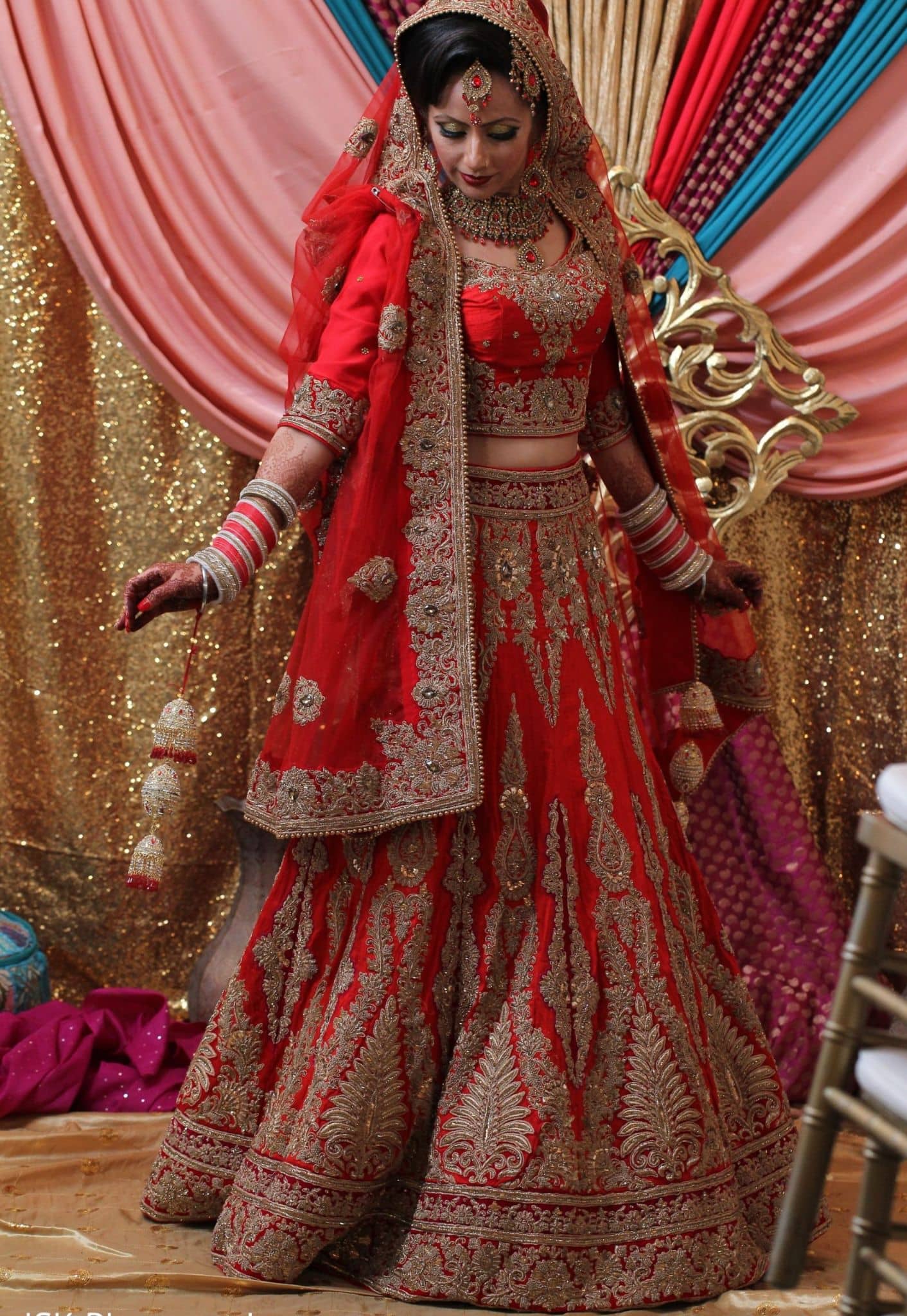 Gorgeous red Punjabi bridal lehenga with huge flares
