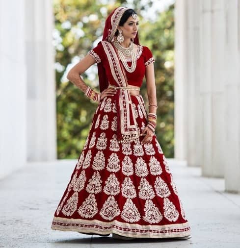 Regal maroon Punjabi bridal lehenga with minimal embroidery work