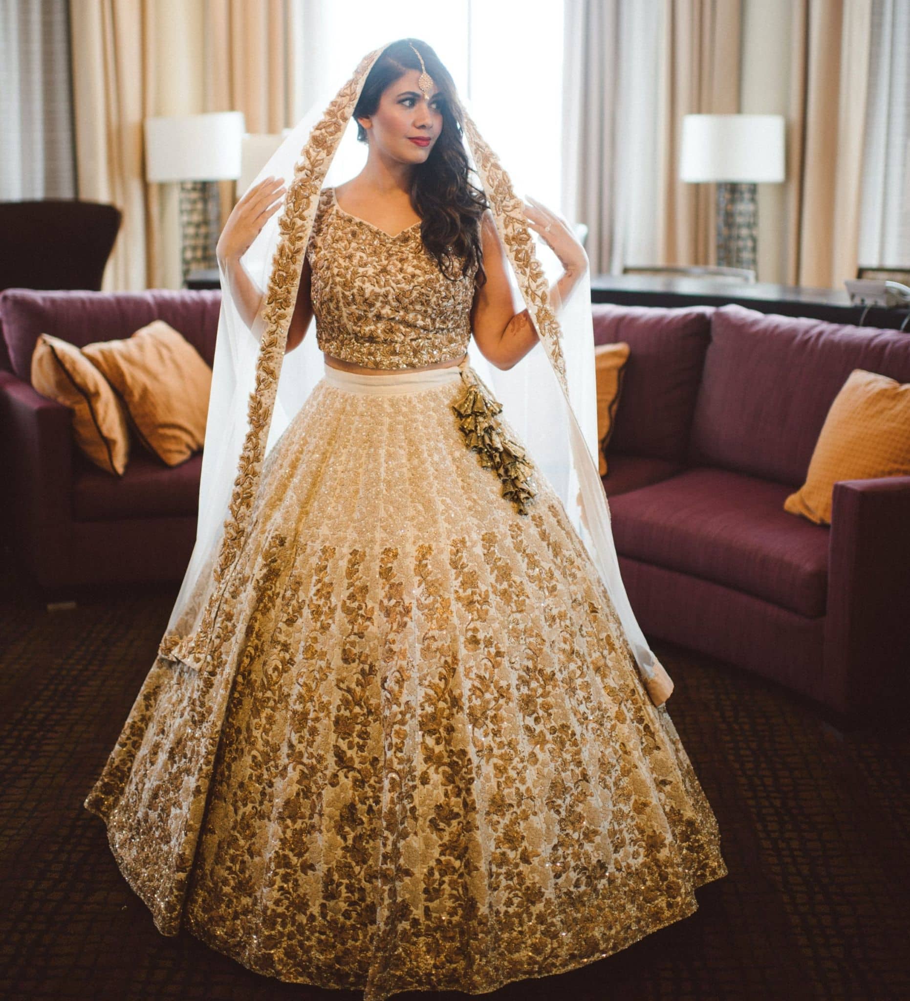 Gorgeous Punjabi bridal lehenga in off white, cream and gold with net <em>dupatta</em>