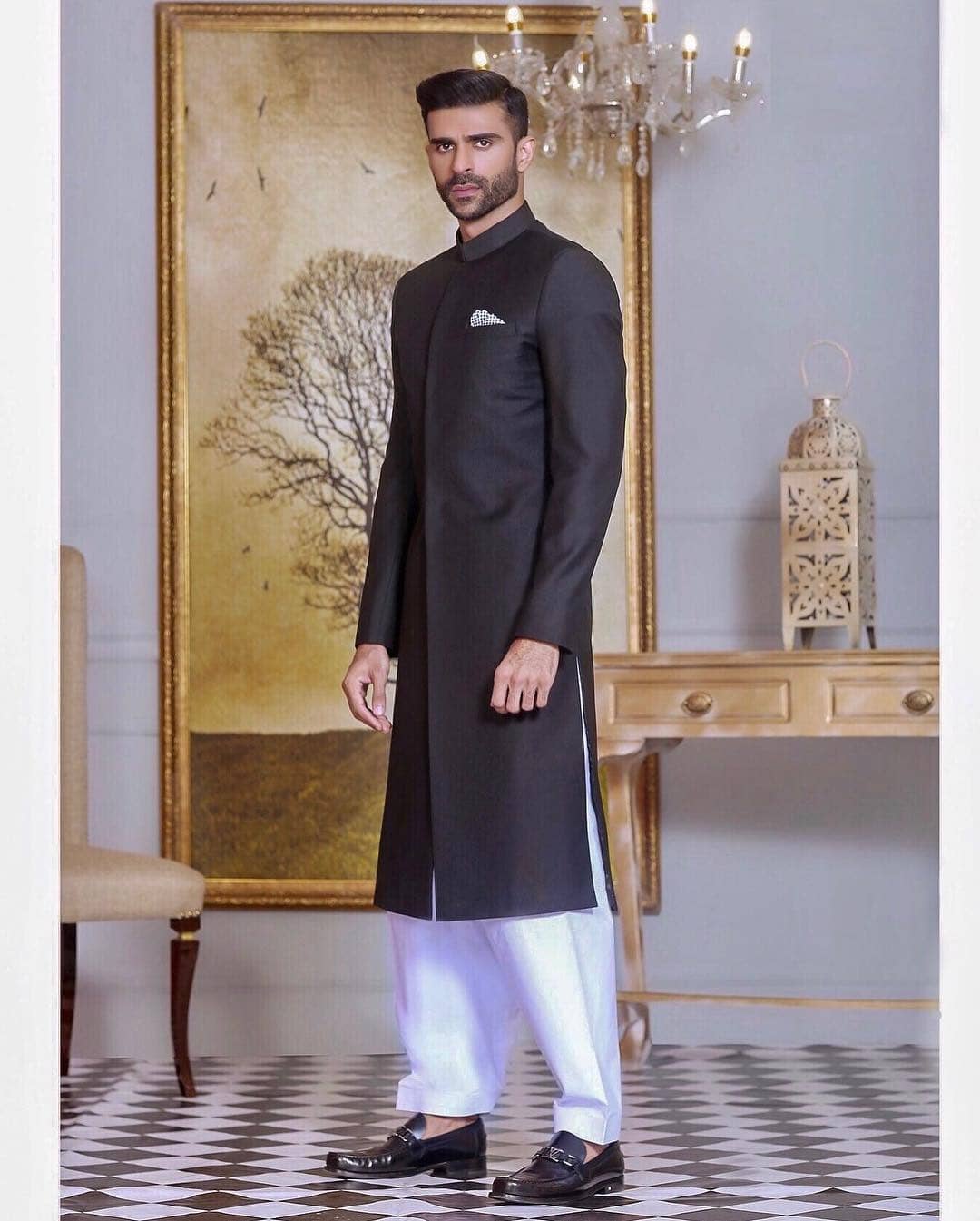 Classic black sherwani in straight-cut design paired with loose-fitted pants
