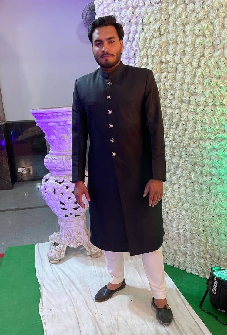 Front slit sherwani in black color with simple white lower