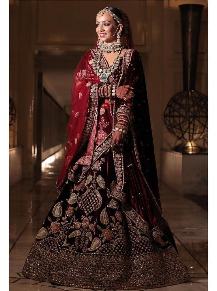  Dazzling bridal lehenga in maroon hue with transparent dupatta