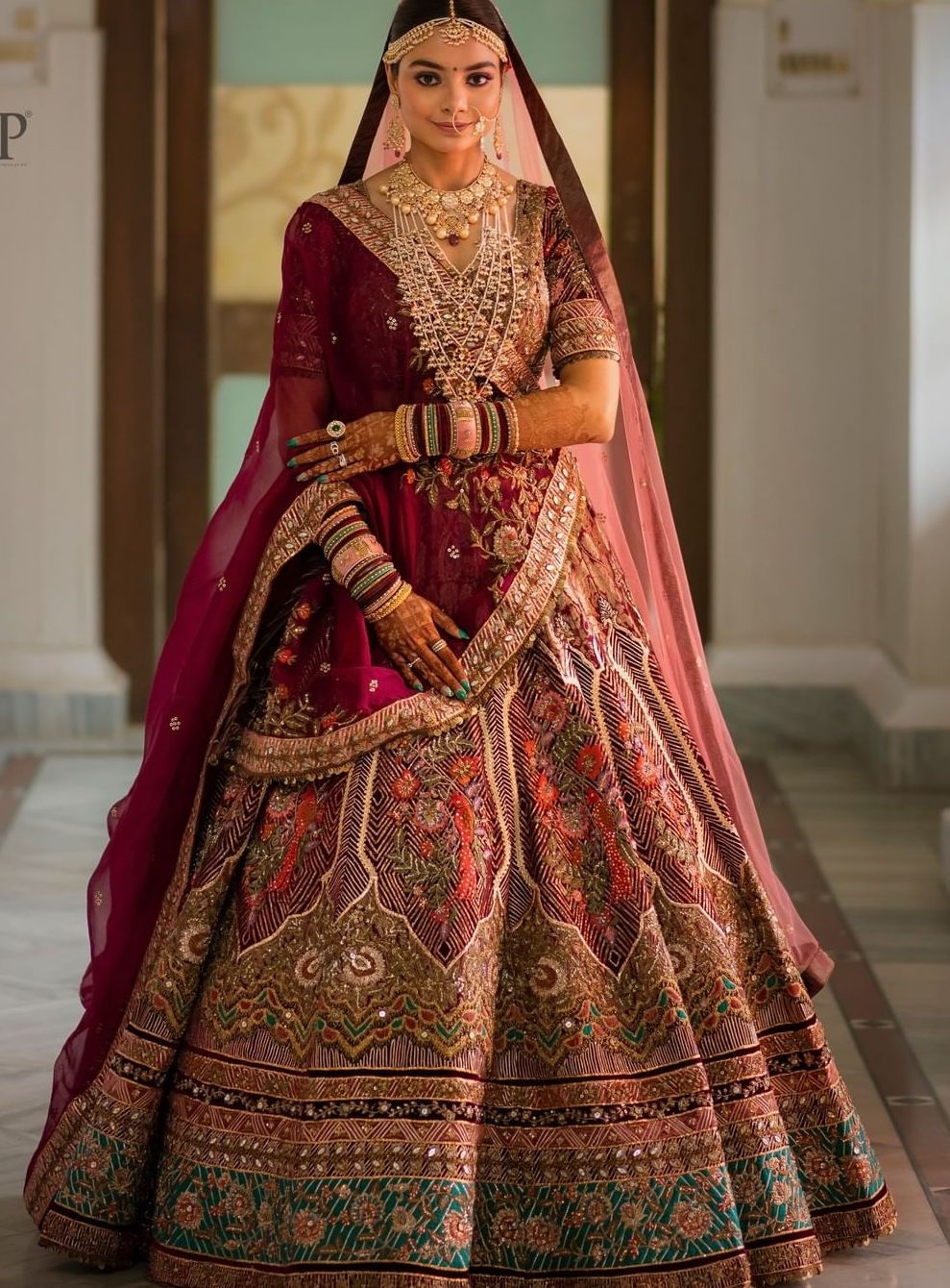 Marwar style regal bridal lehenga in dark maroon