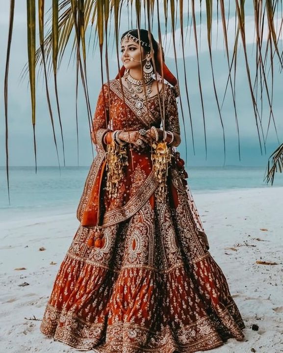 Dreamy bridal lehenga in maroon and silver embroidery work