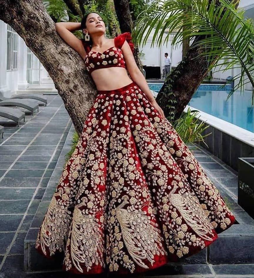 Modern bridal lehenga in maroon color with a twist