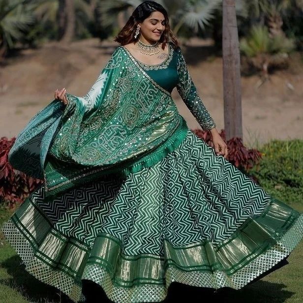 Green bandhani printed lehenga is paired with crop top & jacket – BHARTI's  at White Solitaire