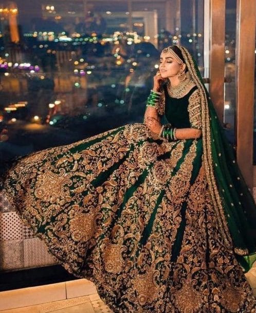 Gorgeous bottle green color bridal lehenga and blouse with net dupatta.  Lehenga set with silver thread