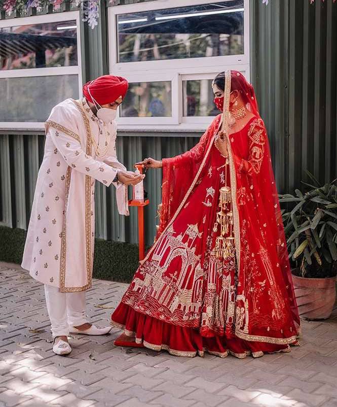 Red Bridal lehenga and White sherwani
